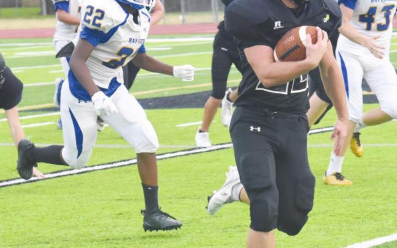 Pirate JV running back Caleb Dean finds plenty of running room as he rounds the corner over the right side against the Bay City Blackcats Thursday, Photo by Randall Luker