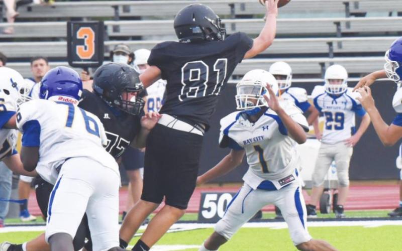 Jarrett Odom gets his hands up to knock down a pass in the junior varsity game against the Bay City Blackcats Thursday, Photo by Randall Luker