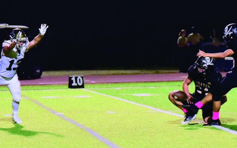 Pirate PAT kicker Sammy Estupinan and holder Jarrett Odom were a perfect four of four versus LCM Friday. Photo by Randall Luker