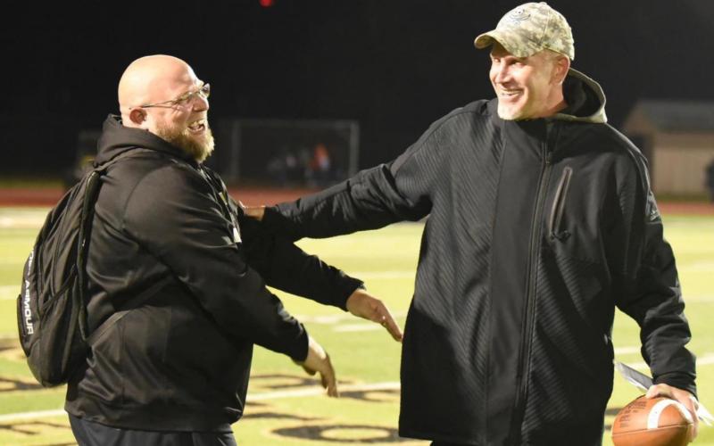 Photo by Randall Luker Vidor Pirate football offensive coordinator Mike Trahan, left, and Vidor Head Football Coach and Athletic Director Jeff Mathews are all smiles after the Vidor Pirates clinched the top spot in district Friday by defeating the Lumberton Raiders 28-27, overcoming a 20 point deficit.