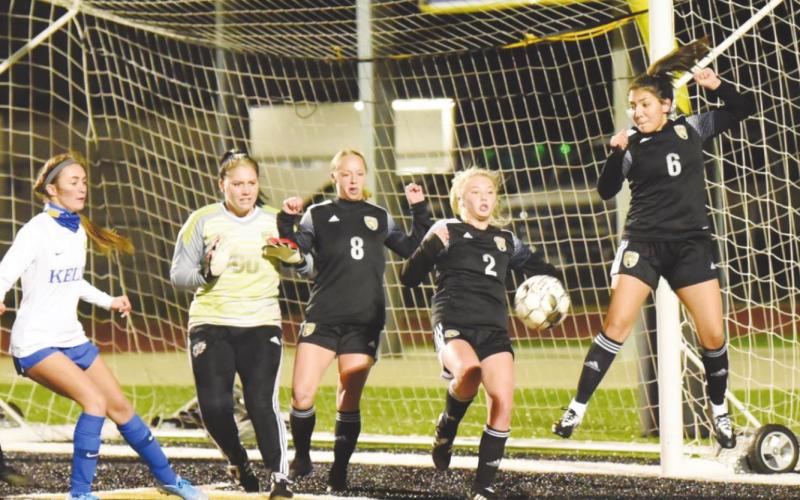 Lady Pirates Audrey Tilley, Ella Bunting, Sabrey Eaves and Estrella Gutierrez fend off a corner kick in Friday’s scrimmage with Kelly.