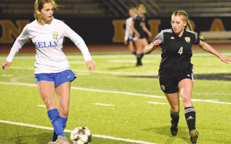 Kinley Lapray looks for a steal in Friday’s scrimmage with Kelly.