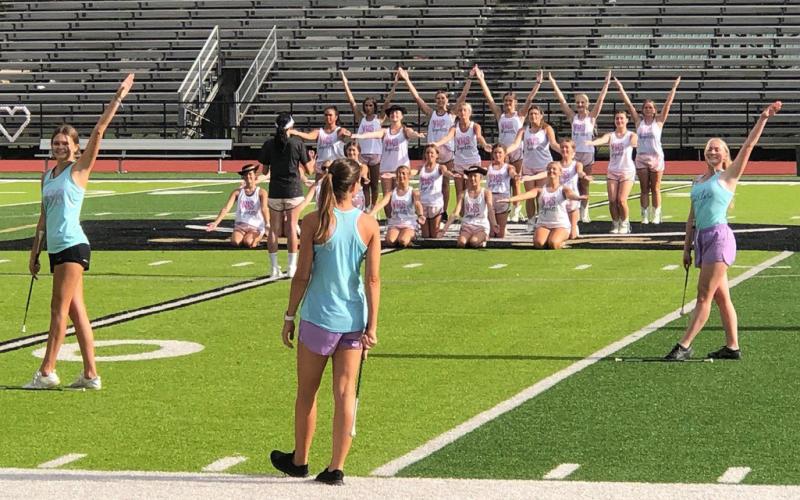 The Vidor High School twirlers and Brigadettes, were practicing at Croak Field Monday afternoon in preparation for the 2022 season opening versus Silsbee Friday at Pirate Stadium. Photo by Randall Luker