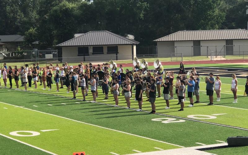 The Mighty Pirate Marching Band practiced their routine with the twirlers and Brigadettes Monday afternoon. Photo by Randall Luker