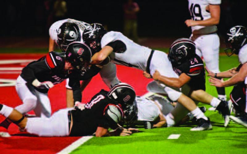 Jason Watson stretches across the goal line for another Pirate touchdown.