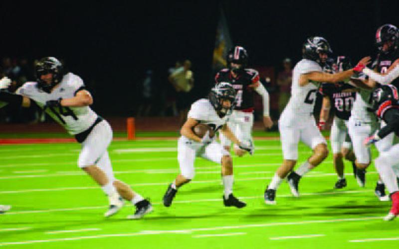 Pirate blockers clear the way for Daigan Venable to pick up a first down.
