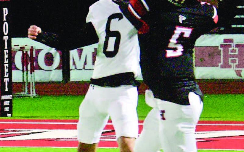 Ayden Trahan, #6, knocks the ball away from a Falcon receiver to help pin Huffman to the two yard line on their final possession.
