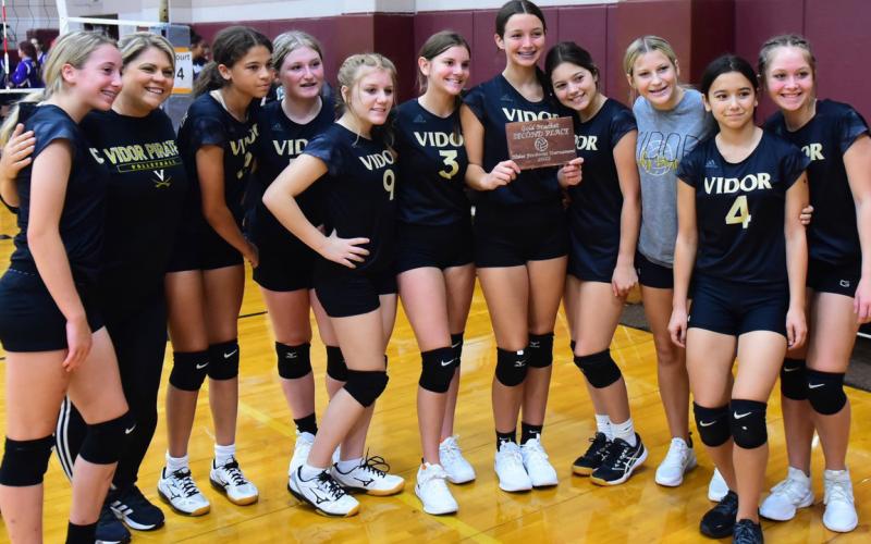 Freshman Lady Pirates place second at Silsbee Tournament and pose with their plaque Saturday. Photos by Randall Luker