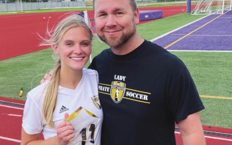 Brooklyn Healy with Vidor Head Girls Soccer Coach Ralph Fields.