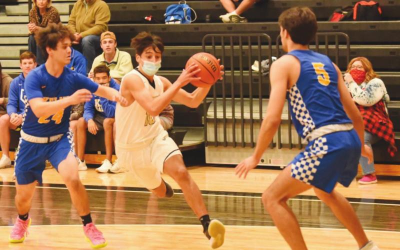 Aiden Ochoa drives on the goal between Kelly defenders Tuesday night.