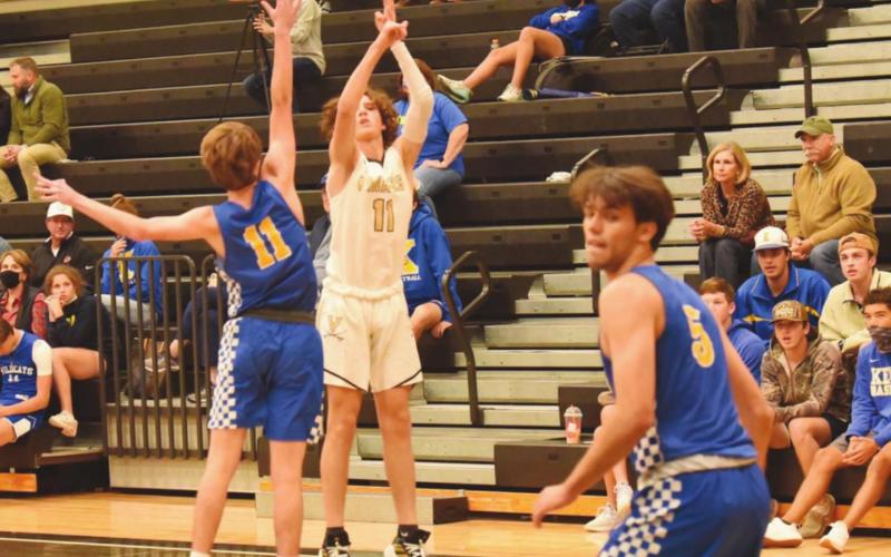 Zander Lindsey shoots over a Kelly defender from three-point territory.