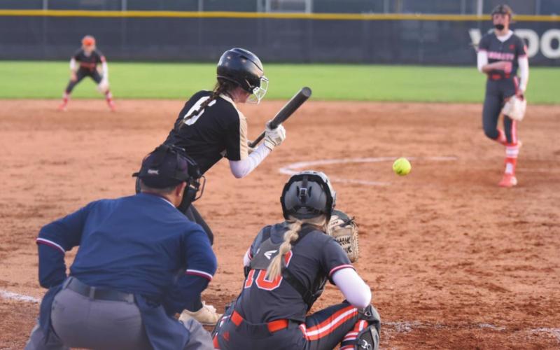 Brooklyn Bushelle pivots for a bunt in the varsity Lady Pirate softball game Thursday.