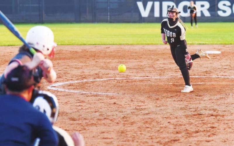 Aarilynne Richardson delivers a strike in the varsity softball game Thursday.