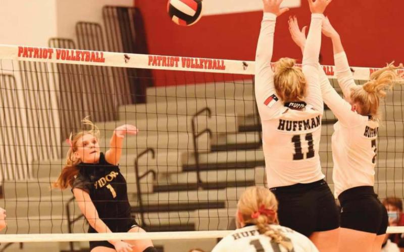 Brooklyn Healy goes airborne as she hits a return in the playoff game versus the Lady Falcons.