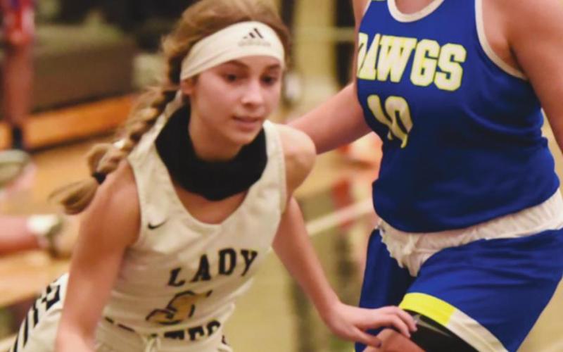 Jana Baters makes her move past a Kelly lady Dawg defender Tuesday night.