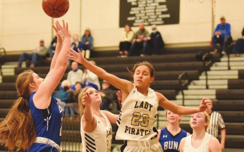 Sofia Rodriguez gets a hand in to block a Lady Cougar.