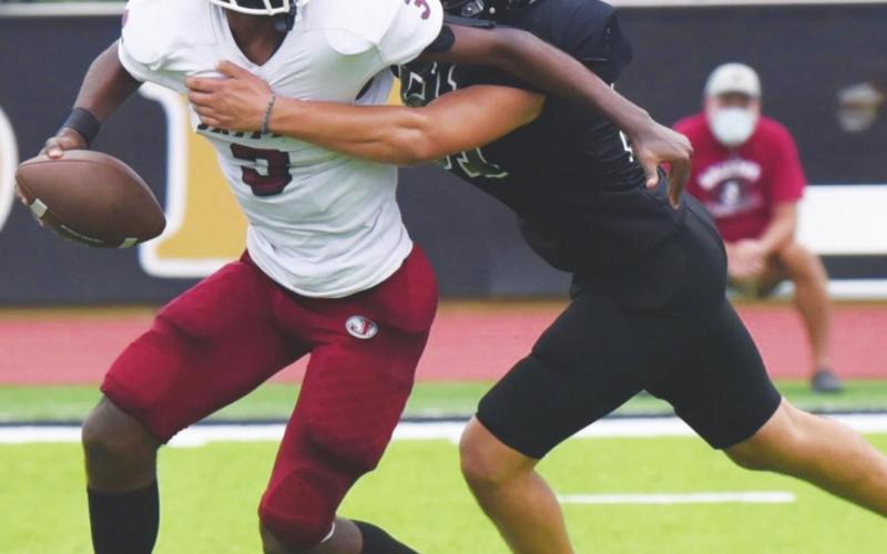Jarrett Odom breaks through the defense to sack the Jasper QB.