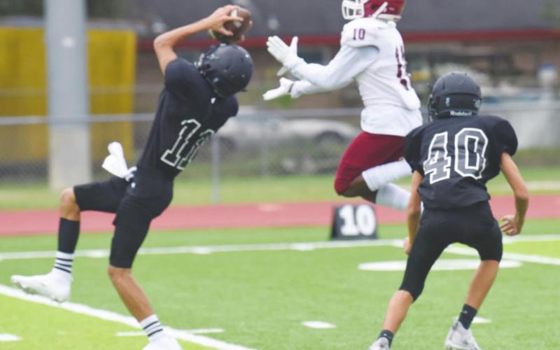 Bryce DuBose steps in front of the intended Jasper Bulldog receiver Thursday for an interception as Ayden Trahan backs him up.