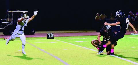 Pirate PAT kicker Sammy Estupinan and holder Jarrett Odom were a perfect four of four versus LCM Friday. Photo by Randall Luker