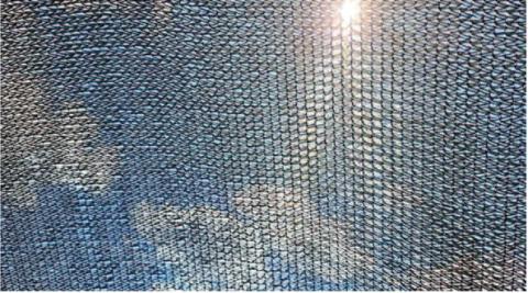 Black shade cloth is often the preferred fabric color because it blocks more UV rays from reaching the plants underneath. A layer of heat does form immediately beneath the cloth, but if the cloth doesn’t touch plants directly (allowing air to circulate), heat will rise through the fabric (image: epicgardening.com).