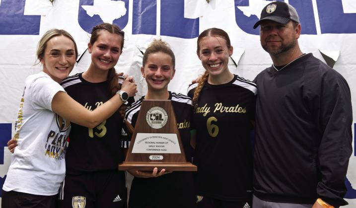 2024 Senior Lady Pirates The three seniors on the 2024 Lady Pirate Soccer team hold the Regional Runner-Up Trophy with (left to right) Assistant Coach Ciera Tinkle, Jillian Allen, Hope Dilley, Railei Mouton and VHS Head Girls Soccer Coach Ralph Fields.