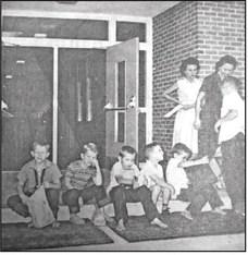 DEJECTION, DISGUST, MIRTH, AND ANTICIPATION, are all expressed on the faces of the youngsters shown in the picture taken on the first day of school at Pine Forest Elementary. According to Mrs. Arlen Portie, principal, registration went well, despite the 'exhausted' looks on the faces of some students shown in the above picture. The only students identified are (l to r) Buddy and Arlos Bennet. (September 10, 1963 issue)
