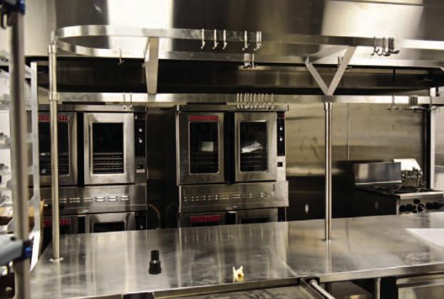 Stainless commercial kitchen appliances fill the school’s kitchen with prep tables, freezers ovens, coolers, ice machines, mixers and other items awaiting the start of school Jan. 9.