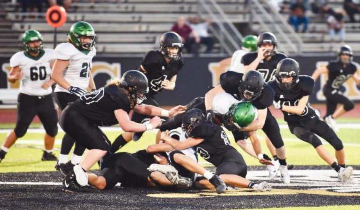 As this defensive swarm illustrates, the JV Pirates dominated both sides of the line Thursday as they defeated the Livingston Lions 28-0.