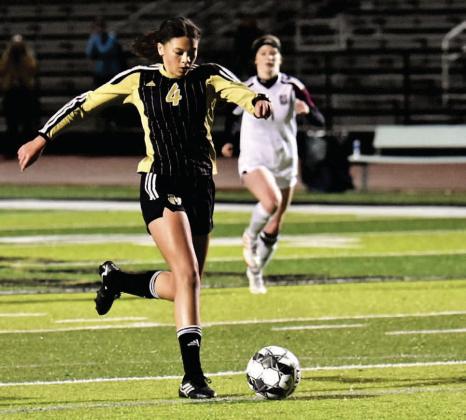 Varsity Lady Pirate Kenya Correia kicks a goal versus Silsbee in the Lady Pirates initial district game. Photo by Randall Luker