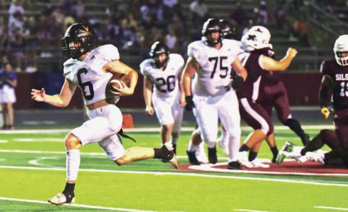 The left side of Vidor’s offensive line opened a big hole in the Tigers’ defensive line to free Dane Villadsen for a 40 yard pickup to the 10 yard line Friday at Tiger Stadium. Photo by Randall Luker