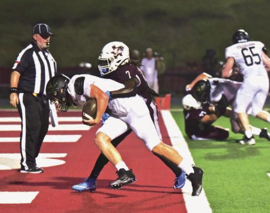 Cashing in on Villadsen’s big run, Isaac Fontnow carried the ball and a Silsbee defender over the goal line for the Pirates’ first score. Photo by Randall Luker