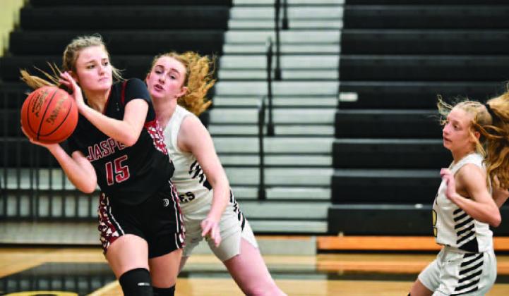 Lady Pirates Natalie Morrison, center, and Mia Robin, right, pressure a Jasper Lady Dawg as she looks to pass Friday at Pirate Gym. Photo by Randall Luker