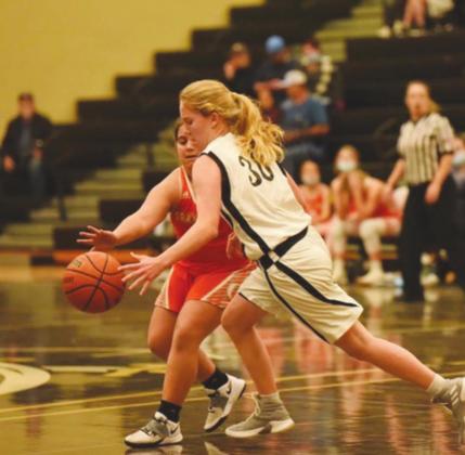 Natalie Hatton dribbles past a Lady Bobcat in the 7th Grade A team game Thursday in Pirate Gym.