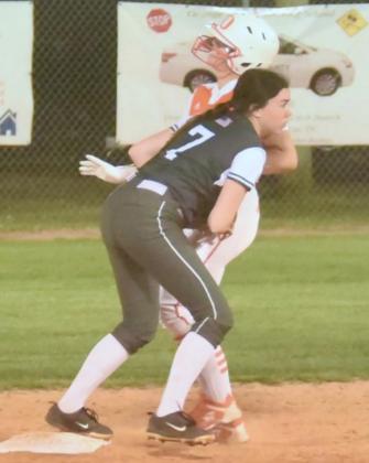 Brilie Cornelison tags out a Lady Bobcat runner at second base. Photo by Randall Luker