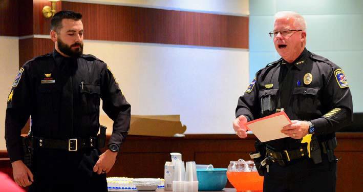 VPD officer Ethan Mansfield, left, was promoted to the rank of sergeant by VPD Chief Rod Carroll, left, in a cermony held at Vidor City Hall Monday. Courtesy Photos