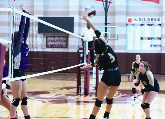 Hannah Bevineu #3, Ava Friend #12 and Miley Rice #15 on offense in the Championship game versus PNG at the Silsbee Volleyball Tournament Saturday.