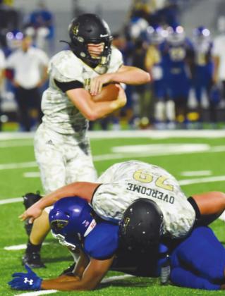Pirate RB Jason Watson protects the ball as Tyler Webb takes a Blackcat defender to the ground in action Friday at Bay City. Photo by Randall Luker