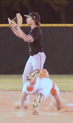 Pirate second baseman Diagan Venable signals to hold the ball as an Orangefield Bobcat runner steals second. Photo by Randall Luker