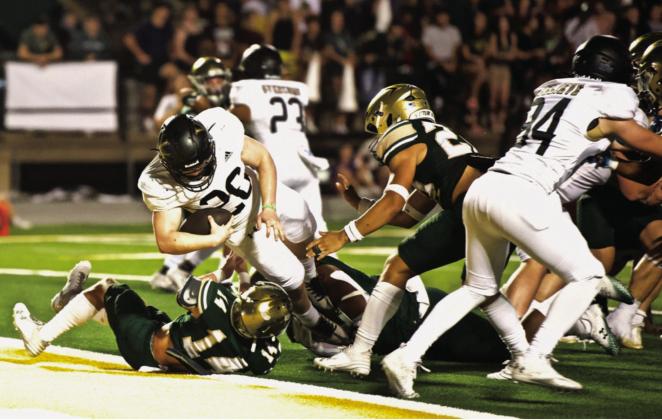 Pirate running back Riley Marlow runs over a Bear defender to score a touchdown Friday at LCM.