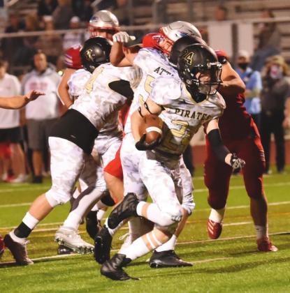 Chase Stansbury blows through the Raider offensive line on his way to a Pirate TD Friday night.