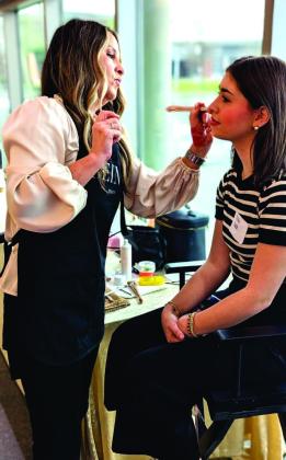 VHS student Maci Verde has her makeup professionally applied as part of the Women In Industry program on how to make the best impression during a job interview.