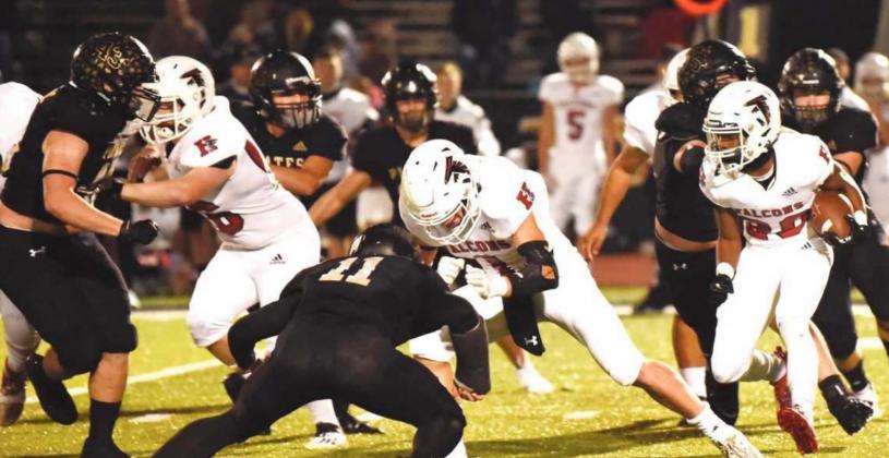 Pirate defenders Colby Smith and Ty Vincent close the front door as Jordan Smith and an unidentified Pirate close in on Falcon RB.