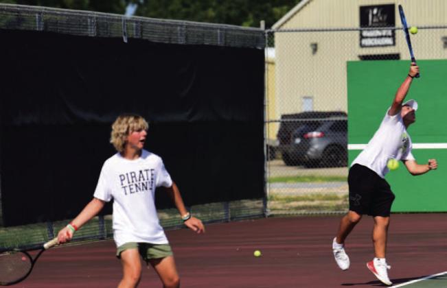 The tennis courts were filled Monday as Vidor Tennis hosted Goose Creek Memorial to open the 2023 season play. Boys’ singles competitors Gideon Rowe (sophomore), left, and Austin Gibbs,(junior), right, battle their opponents. Photo by Randall Luker