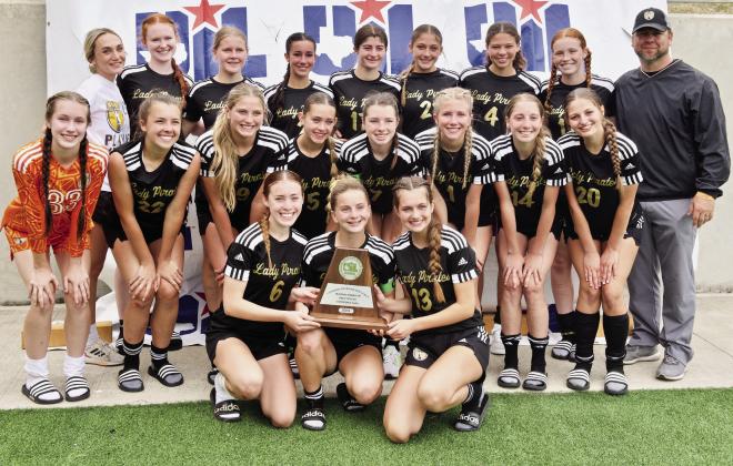 The Vidor Lady Pirates hold their 4A Regional Runner-Up trophy Saturday at Legacy Stadium in Katy. Lady Pirate soccer set numerous records as they advanced to the Championship Round in the Regional playoffs.