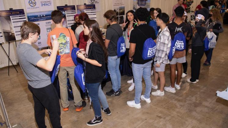 Students gather at the Port of Beaumont booth.