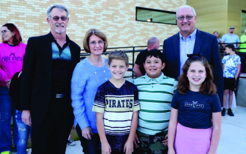 Mr. Harland, Mrs. Herring-Granger, and Mr. Burr are joined by the current Oak Forest Flag Crew - Turner Smith, No Cabrera, and Ellie Hughes. VISD Courtesy Photo