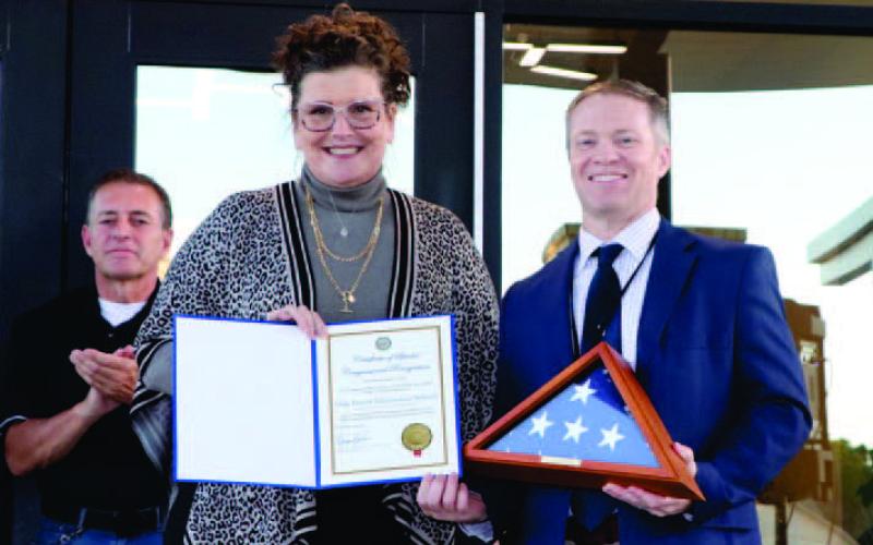 Lanie Brown with Congressman Brian Babin's office presents Dr. Killgo with an American Flag that has been flown over the US Capitol in Oak Forest Elementary's honor. VISD Courtesy Photo