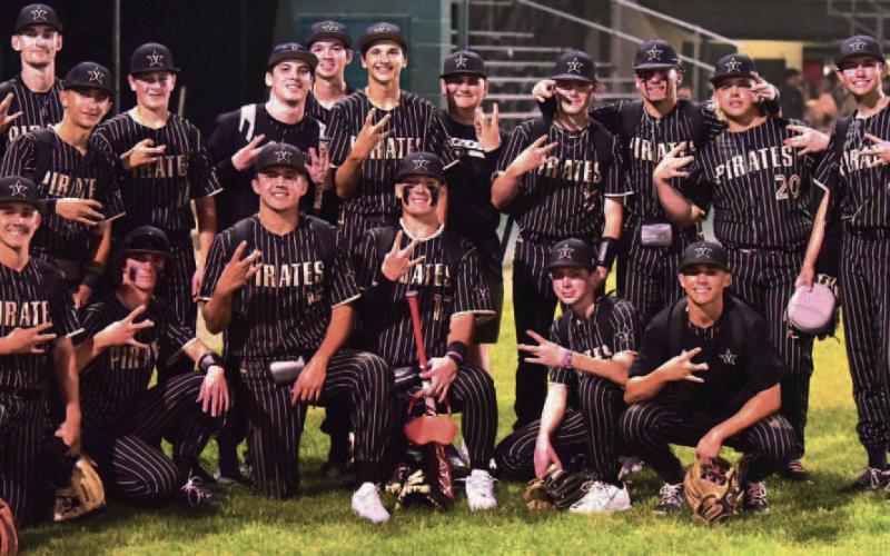 The varsity Pirate baseball team pose for a team photo after sweeping the LCM Bears Friday at LCM.