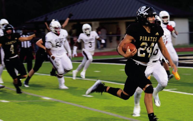 Pirate QB Jarrett Odom heads for the end zone and Vidor lone TD Friday after a Brayden Root interception gave Vidor the ball on the Silsbee 16 yard line. Photos by Randall Luker