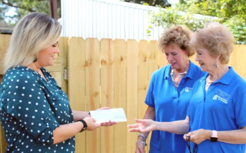 Laura Roberts, Team Leader of Leadership Southeast Texas Orange County Team #1, presents a check for $1,000 to Vivian DeJohn, Executive Director of Birthright of Orange, and Clara Fults, Assistant Director at Birthright of Orange. The money was donated by Pecan Acres Baptist Church and Wellspring Credit Union. Courtesy Photo
